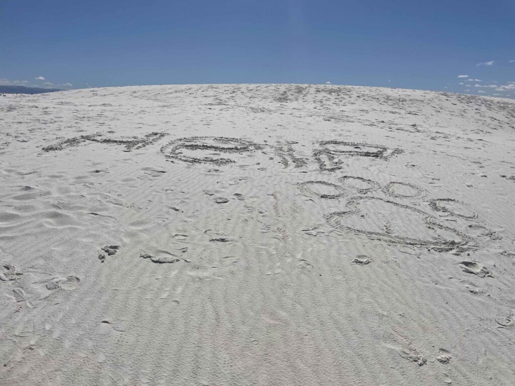 Image in the sand asking for help