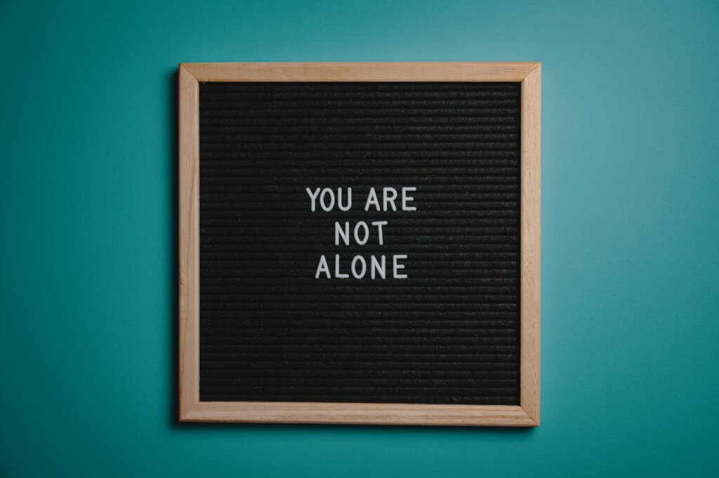 You are not alone words on a bulletin board