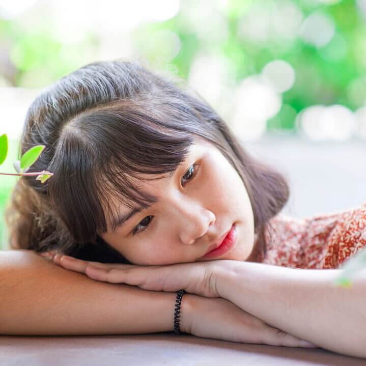 a teenager lost in thought