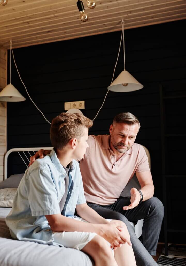a father talking to his teen son